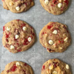 overhead shot of raspberry white chocolate chip cookies on cookie sheet