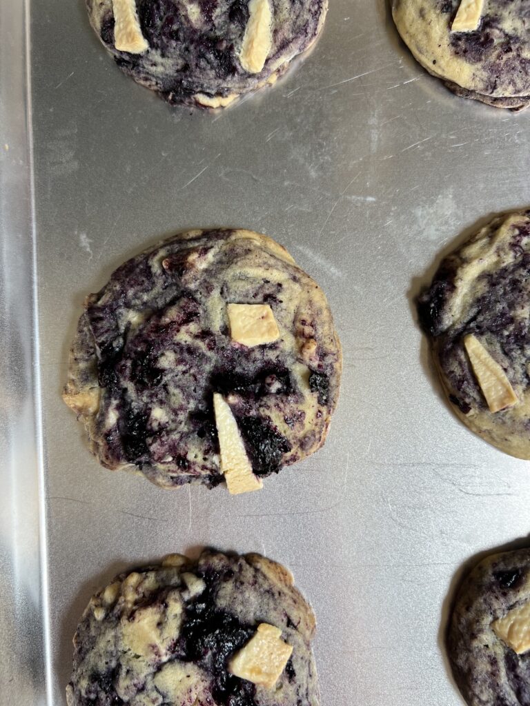 lemon blueberry white chocolate chunk cookies from above on a sheet pan