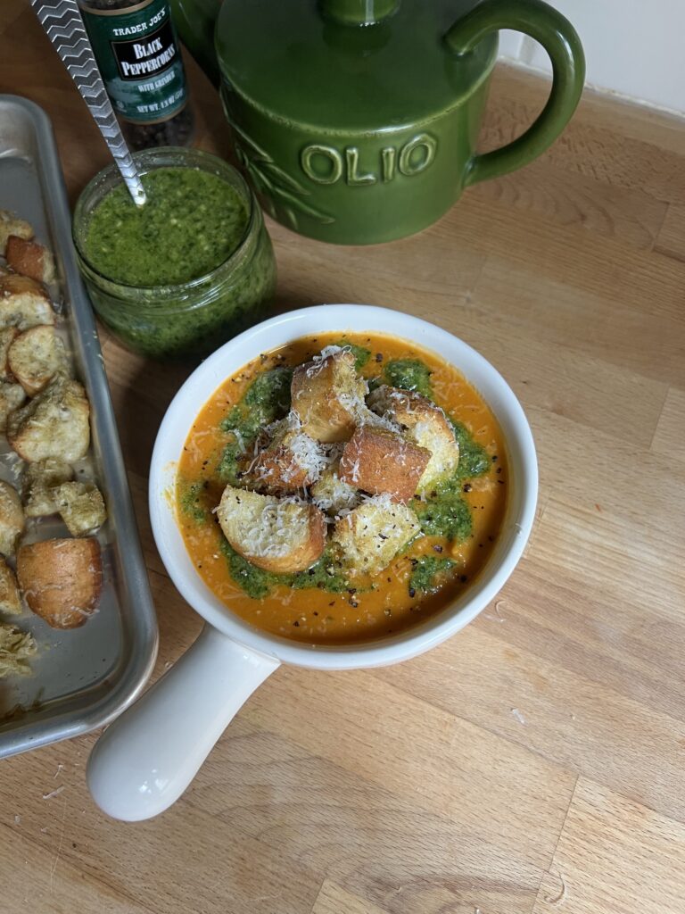 heirloom tomato and butternut squash soup from aerial view in a white bowl 