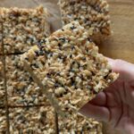 miso brown butter Rice Krispie being held with one hand