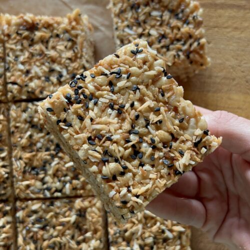 miso brown butter Rice Krispie being held with one hand