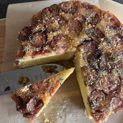 salted honey upside fig butter cake from above with 1 slice cut out